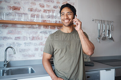 Buy stock photo Happy, smile and man on a phone call in the kitchen of his home talking on technology for communication. Happiness, young and man from colombia having mobile conversation on a smartphone in his house