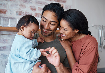 Buy stock photo Family with down syndrome baby, happy parents in kitchen home together and young child care. Indian father holding cute kid, asian mother smile with support and bonding happiness in Brazil house