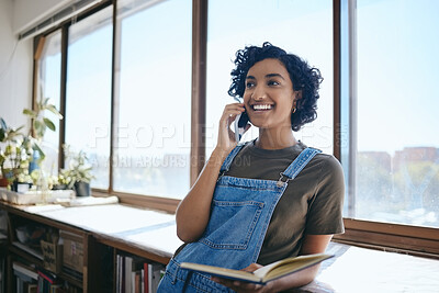 Buy stock photo Phone call, communication and creative business woman talking and planning advertising project on a smartphone. Black woman networking on cellphone and reading notes in notebook in an office at work