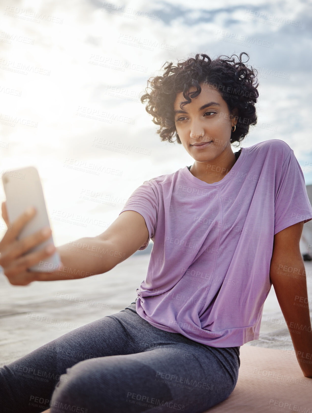 Buy stock photo Fitness, exercise and woman taking a selfie on a phone while doing outdoor workout in the city. Healthy, young and girl athlete from puerto rico taking picture on smartphone while doing yoga on a mat