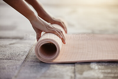 Buy stock photo Macro of yoga, floor and woman hands with mat after exercise in gym, home or patio. Girl roll up gear after training, workout and fitness in stretching, breathe and mindfulness practice outside