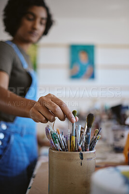 Buy stock photo Hand, creative woman and art brush of artistic student picking paintbrush for work at the studio or workshop. Female artist hands taking a brushes from a bucket for design, painting or project