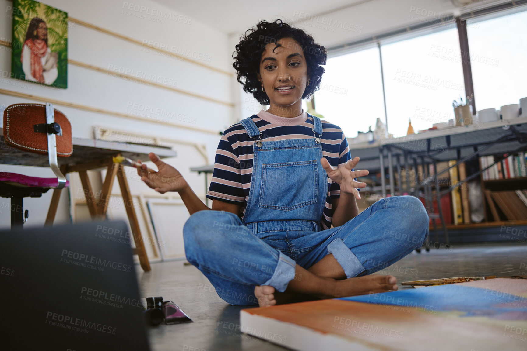 Buy stock photo Woman, artist and laptop in studio on video call with client, agent or manager of gallery deal in sale of painting. Painter, computer and webinar on the internet for art workshop, class or seminar