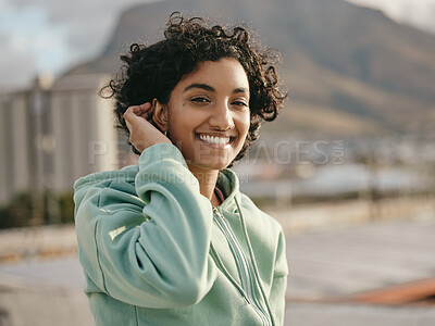 Buy stock photo Face, smile and happy young woman feeling free and happy while smiling outside against an urban city background. Portrait of a indian female with an attractive, trendy or edgy style while on rooftop