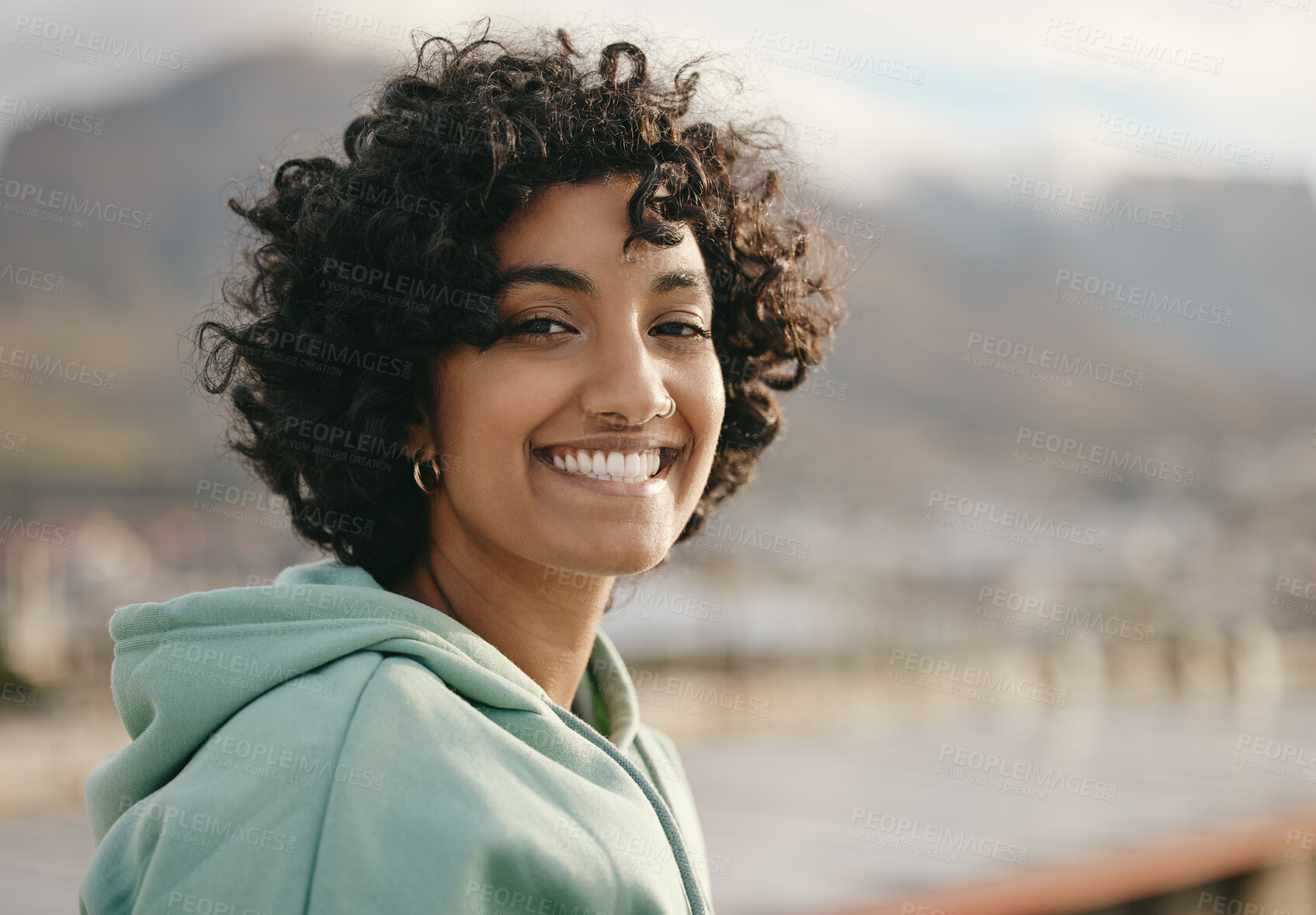 Buy stock photo Portrait, face and indian woman on a rooftop, relax and happy while enjoying sunrise and city views. Freedom, peaceful and wellness girl meditating, start day with positive mindset and relaxation