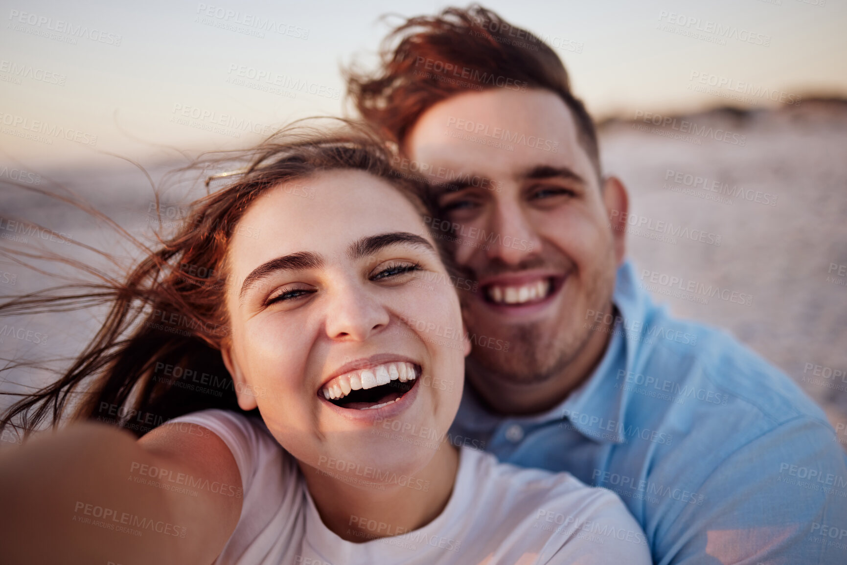 Buy stock photo Couple, smile and beach together for selfie with happiness on face on holiday, honeymoon or vacation. Man, girl and happy at ocean on travel in summer in romantic photo for love, bonding and care