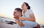 Happy, couple and piggyback for love on the beach in joyful fun and happiness together in the outdoors. Man and woman enjoying summer vacation at the ocean coast in playful romance in Costa Rica