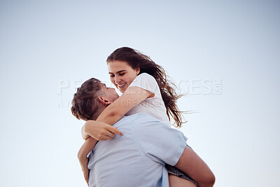 Buy stock photo Hug, happiness and love of a couple together in an embrace with a smile in summer. Happy girlfriend and boyfriend feeling relationship gratitude spending quality time with a blue sky background 