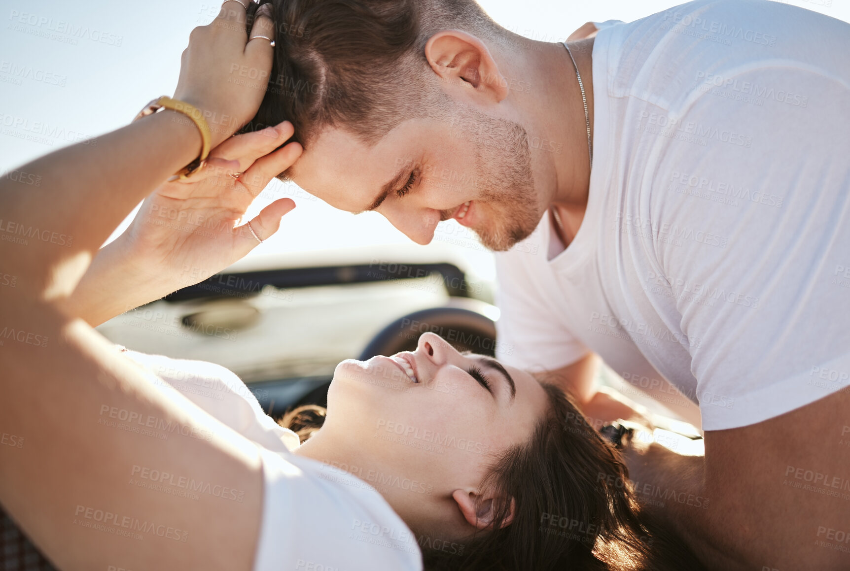 Buy stock photo Love, couple and look at each other being happy, smile and romantic bonding together, celebrate relationship and talking. Romance, man and woman enjoy loving moment, passionate and being playful.