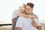 Love, hug and relax couple on car for peace, freedom and sun on romantic road trip date for quality bonding time. Holiday, travel or calm young man and woman together with transport and sun flare