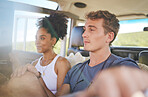 Road trip, caravan and couple on a journey countryside, safari adventure, or travel vacation and relax in summer. Young diversity people or friends in car together for a nature picnic date together