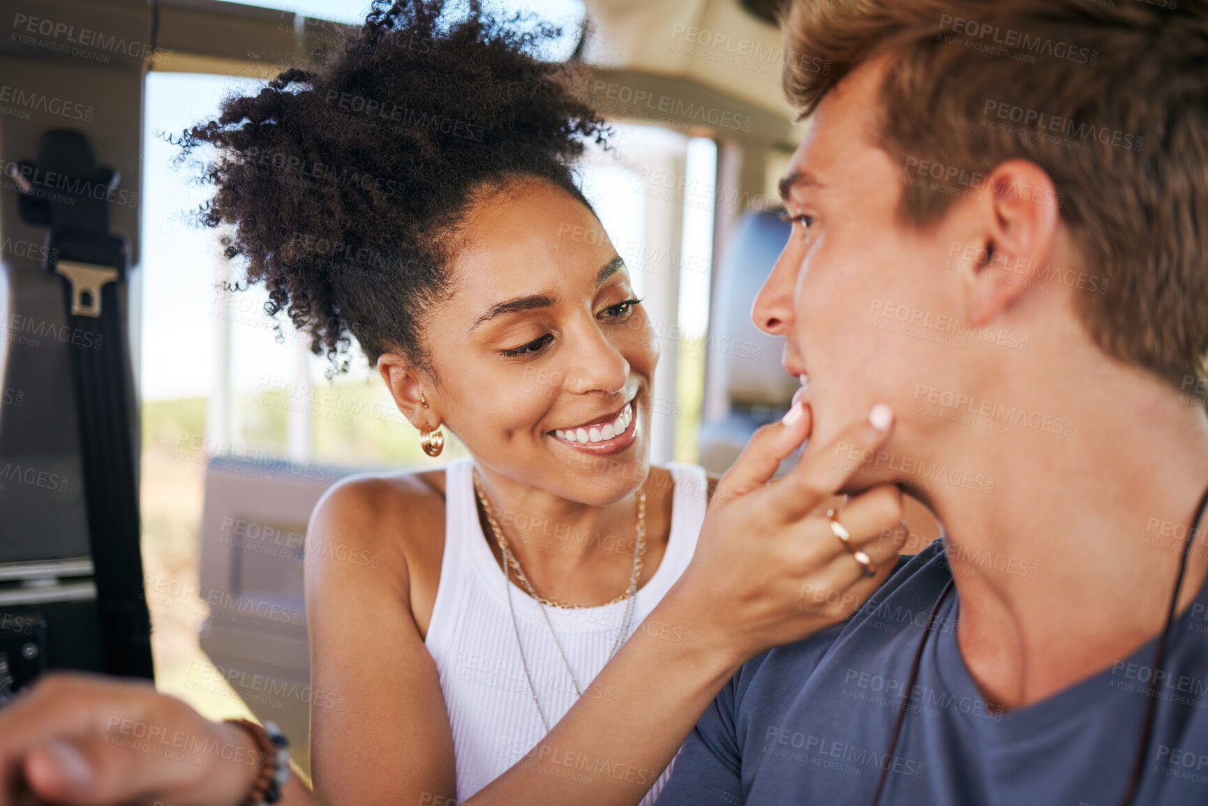 Buy stock photo Interracial couple, love and travel care touch of a black woman touching a man face in a car. People or friends in transport ready for summer holiday, vacation and traveling trip together in a motor