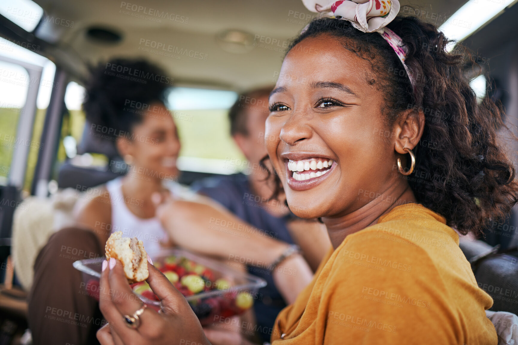 Buy stock photo Happy black woman, smile and eating on road trip adventure with friends in travel for summer vacation or journey. African American female smiling and enjoying a healthy meal for holiday traveling