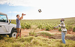 Nature. soccer and men throw a football on a road trip travel break in the countryside. Exercise and fitness of people outdoor during a motor transportation trip adventure on green grass in summer