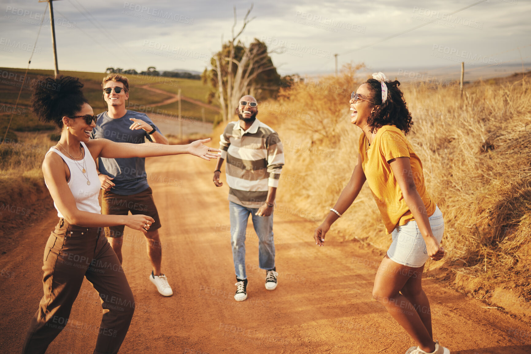 Buy stock photo Diversity, friends and dance outdoor on holiday, relax and fun enjoy a road trip together to celebrate vacation. Multiracial group and students outside on gravel path in summer, happy and dance