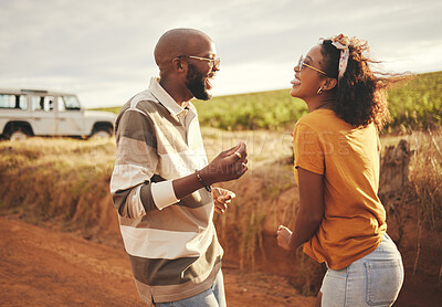 Buy stock photo Conversation, couple and road trip travel on a dirt road feeling happy about vacation freedom. Communication and laughing of a girlfriend and boyfriend with happiness talking about a holiday together