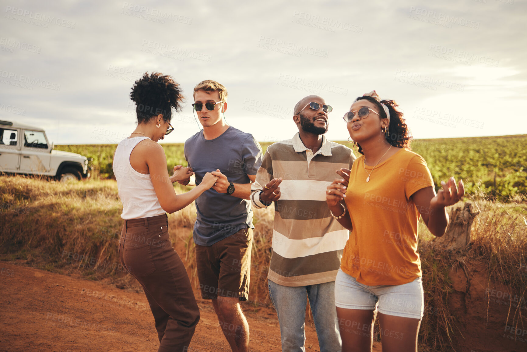 Buy stock photo Diversity, friends and dance outdoor on holiday, vacation and relax together on dirt road trip in countryside. Group, students happy and travelling in summer for getaway or fun weekend away as couple