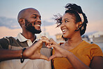 Hand sign, black couple and celebrate relationship being happy, smile and romantic outdoor together. Love, man and woman smile, relax and on holiday and vacation for bonding, anniversary or romance. 