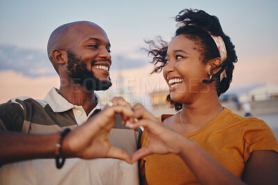 Buy stock photo Black couple, heart hand and celebrate relationship being happy, smile and romantic outdoor together. Love, man and woman smile, relax and on holiday and vacation for bonding, anniversary or romance.