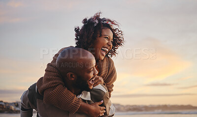 Buy stock photo Black couple, travel and beach fun while laughing on sunset nature adventure and summer vacation or honeymoon with a piggy back ride. Comic, energy and black man and woman love on ocean holiday