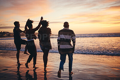 Buy stock photo Silhouette, friends and at the beach or sea relax, happy and have fun with sunset view on vacation together. Group, men and women or couples travel, enjoy seaside and ocean holiday weekend bare feet.