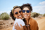 Couple travel portrait, Dubai desert with summer sunglasses and care free tourism road trip together. Happy women in outdoor vacation, closeup smile on natural sandy street and adventure journey