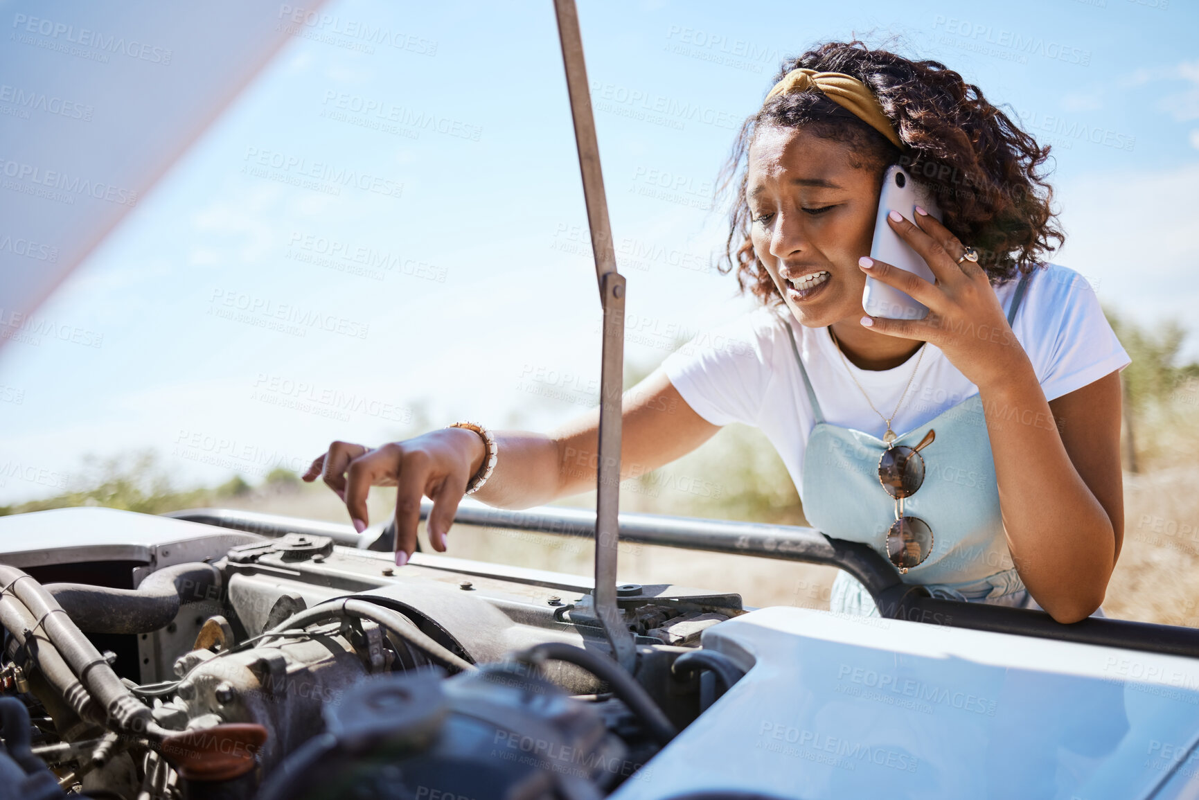 Buy stock photo Car trouble, phone call and woman call for help on road trip, stuck a street and looking at the engine. Stop, stress and anxiety with black woman in the countryside, nervous driver traveling alone