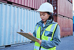 Logistics, shipping and asian woman engineer writing checklist report for inspection or delivery control of cargo containers at shipyard. Supply chain worker in safety helmet at a warehouse in Korea
