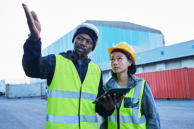 Buy stock photo Logistics, black man and Asian woman with tablet, shipping and conversation for container planning, cargo and supply chain delivery at shipyard. Employees, strategy 
and discuss import and export. 