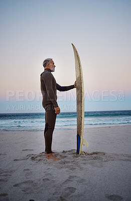 Buy stock photo Surfing, surfboard and senior man on beach for water sports adventure trip standing in sand watching sea waves at sunset. Surfer male at ocean in summer for surf retirement or travel in Australia