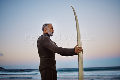 Buy stock photo Surfer, surfboard and senior man at the beach during sunset after surfing on the waves in the sea water. Elderly male on a surf travel vacation in hawaii to enjoy sport, hobby and tropical weather