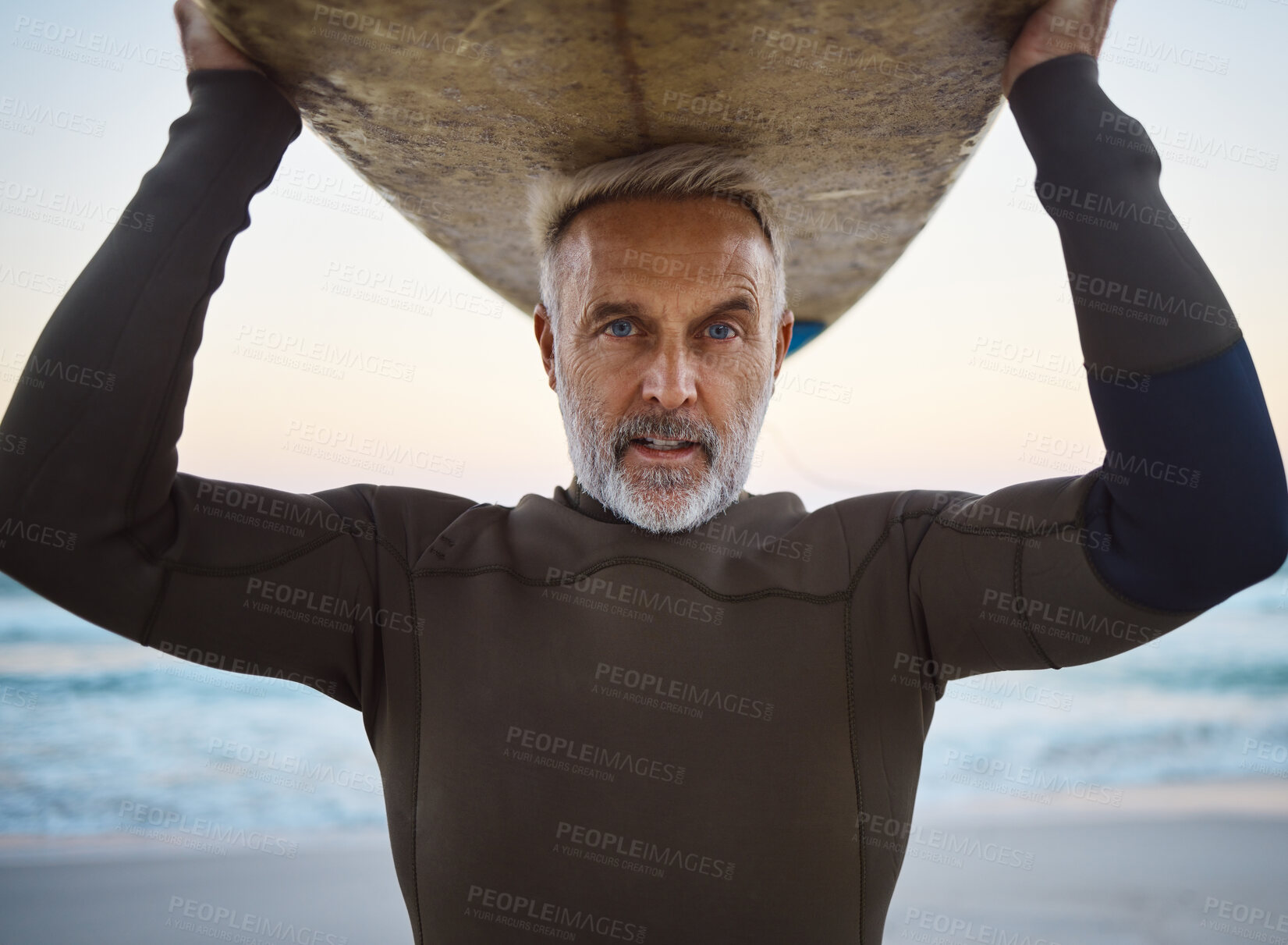Buy stock photo Beach, surf board on head and a mature surfer man with ocean waves and sea sand. Freedom, water sports and fun on retirement holiday in Australia. Health, fitness and senior in wetsuit for surfing