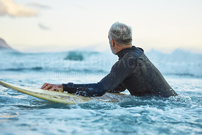 Buy stock photo Water, board and surfer surfing the waves at the beach on holiday in Thailand during sunrise in summer. Man in the ocean with a surfboard on a travel vacation for nature adventure by the sea 