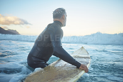 Buy stock photo Senior man surfing in sea ocean, water waves in Australia sky and mental health retirement. Training body at beach for competition, summer exercise and travel surfer fitness lifestyle in peace nature