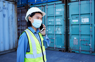 Buy stock photo Covid, phone and supply chain logistics with a woman shipping worker on a call while on a commercial container yard. Freight, cargo and communication with a female courier at work with export storage