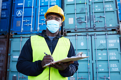 Buy stock photo Covid, documents and supply chain logistics with a black man shipping expert at work on a commercial container dock. Clipboard, freight and cargo with a courier in a mask working in export industry