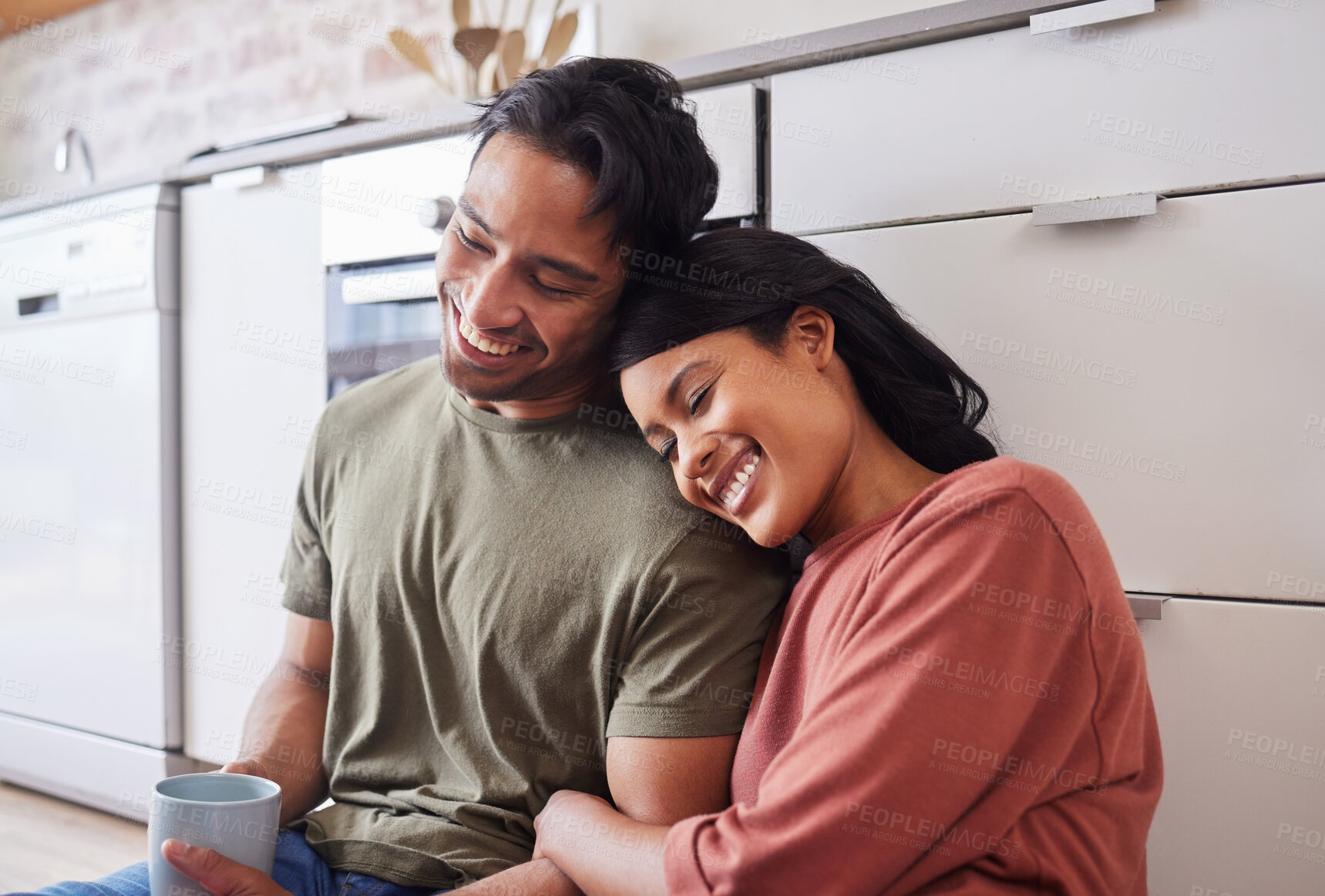 Buy stock photo Relax, smile and couple with coffee in the morning on the floor of kitchen in their house. Happy and young man and woman with love, marriage and happiness in their home with tea for calm and peace