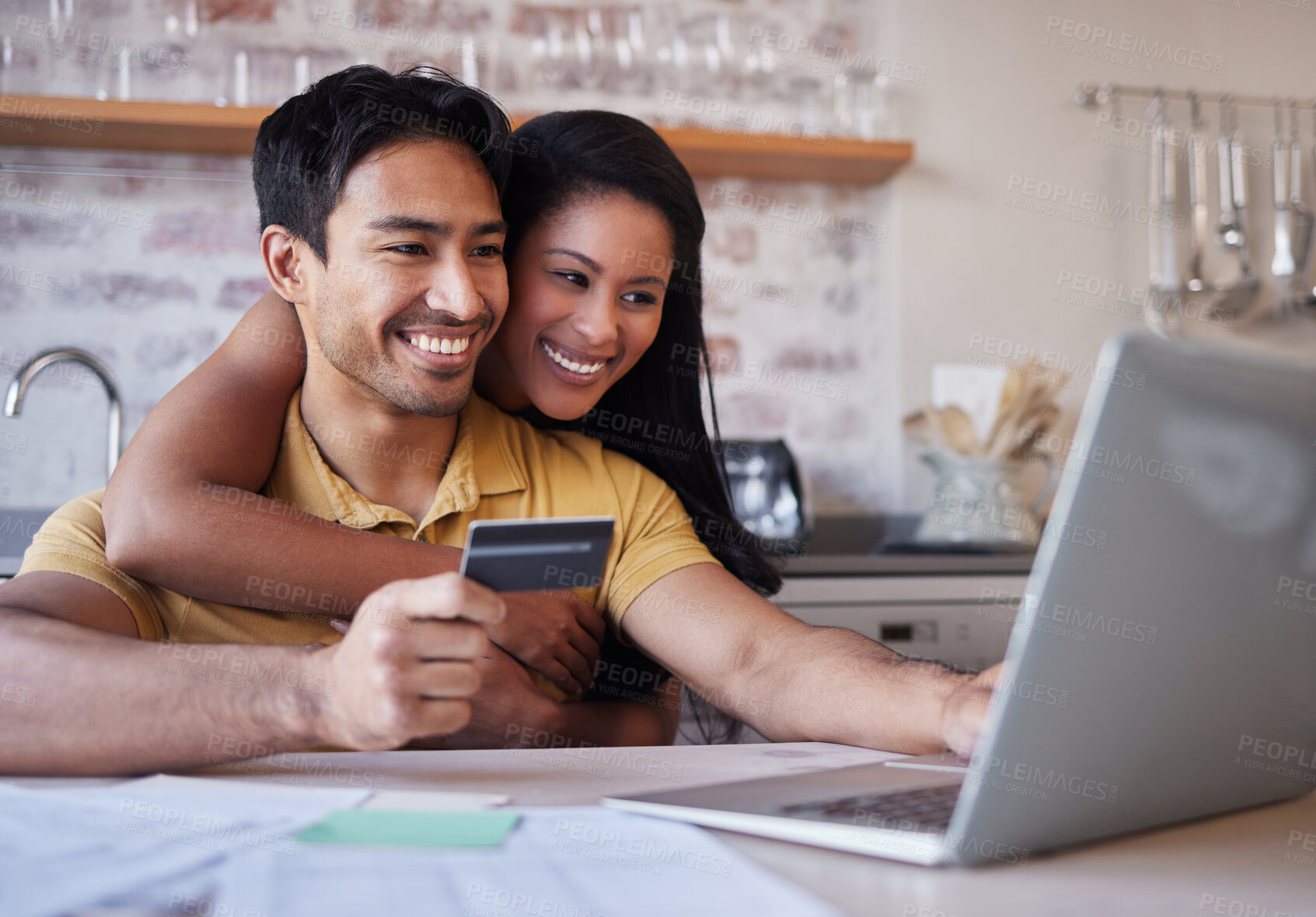 Buy stock photo Laptop, credit card and finance with an accounting couple using a computer for ecommerce in the kitchen of their home. Money, savings and investment with a man and woman making an internet purchase