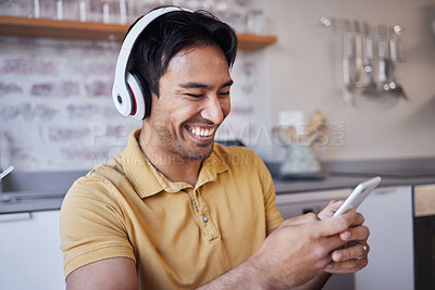 Buy stock photo Phone, music and man on social media laughing at a funny joke on a podcast, network app or video streaming website. Smile, meme and happy Asian person sharing trendy online content to relax at home