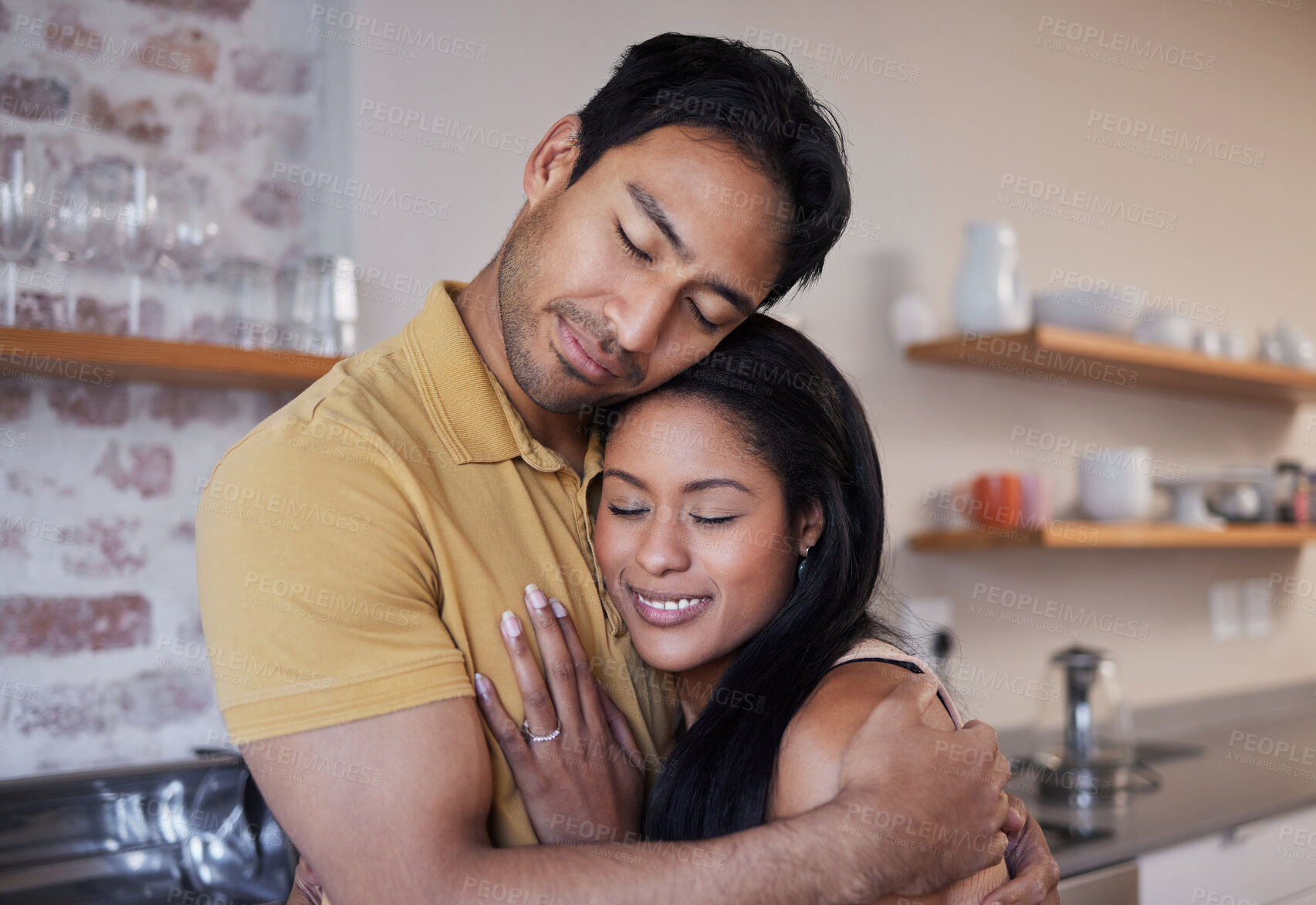 Buy stock photo Care, love and happy couple hug and relax at home enjoying quality time together. Loving and romantic lovers bonding and cuddling in the house expressing feelings of happiness, smile and romance