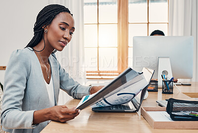 Buy stock photo Black woman, office and report at desk reading with laptop for research, education or learning at work. Woman, training and paper with computer for development, growth and study at business in Paris