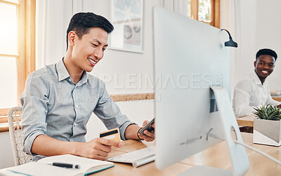 Buy stock photo Credit card, online payment and businessman shopping on mobile app on a phone in an office at work. Asian employee banking with debit card on smartphone, happy with retail and finance on the web