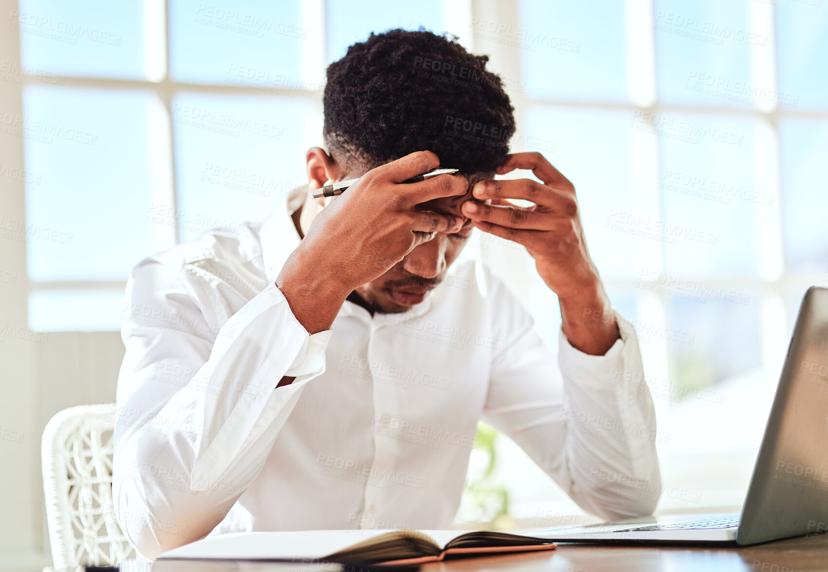 Buy stock photo Headache, stress and businessman with burnout from work problem in office. Sad and tired corporate African employee with anxiety and depression while working on a project on internet with a laptop