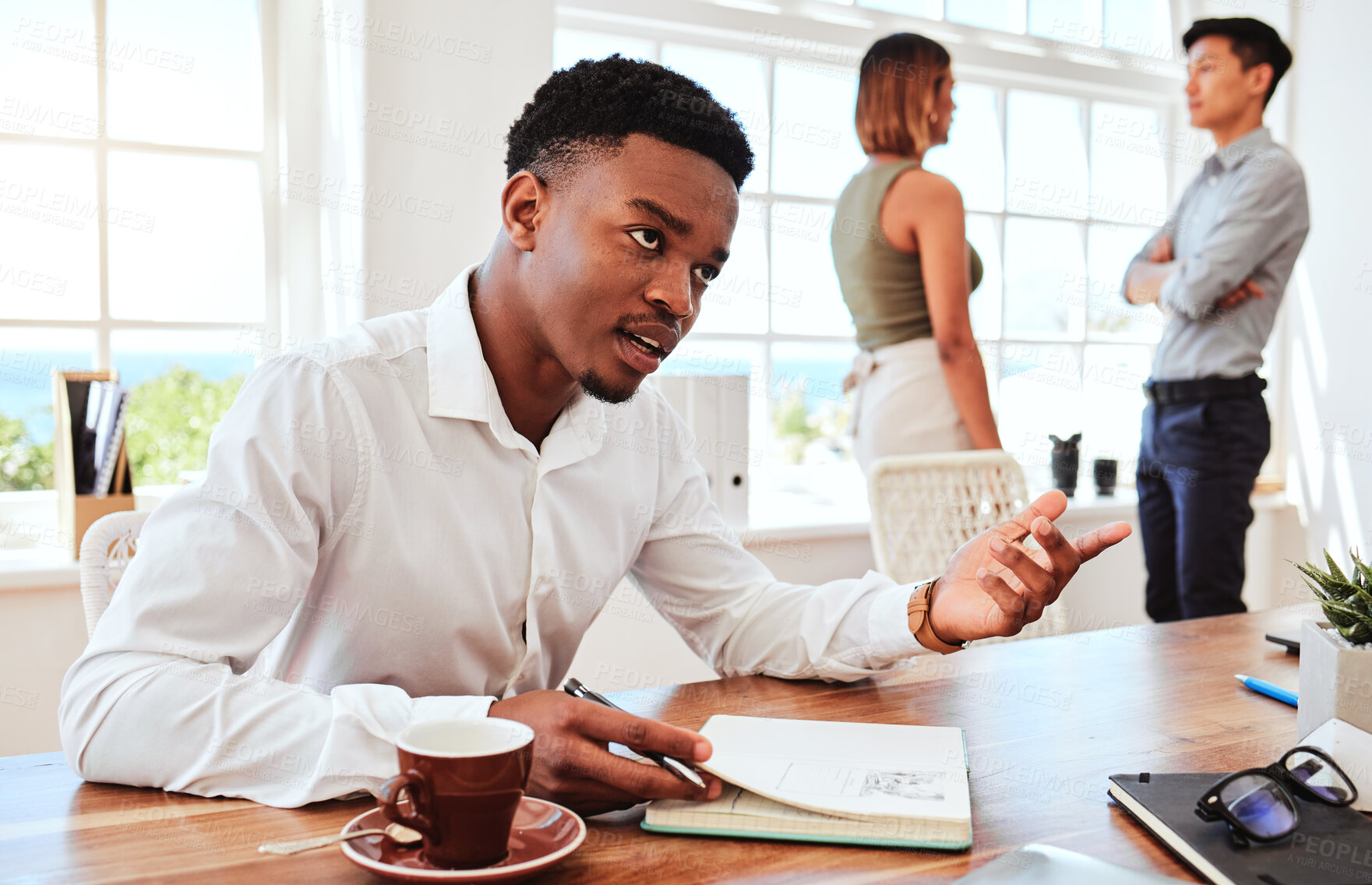 Buy stock photo Black man, coffee and writing in communication in office, planning or marketing strategy notebook. Tea, relax and male talking, discussion or taking notes on startup ideas with coworkers in workplace