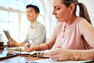 Buy stock photo Business woman, focus and planning in meeting in office and workplace writing notes for collaboration project. Team, female and mature lady with ideas, inspired or brainstorming strategy at workspace