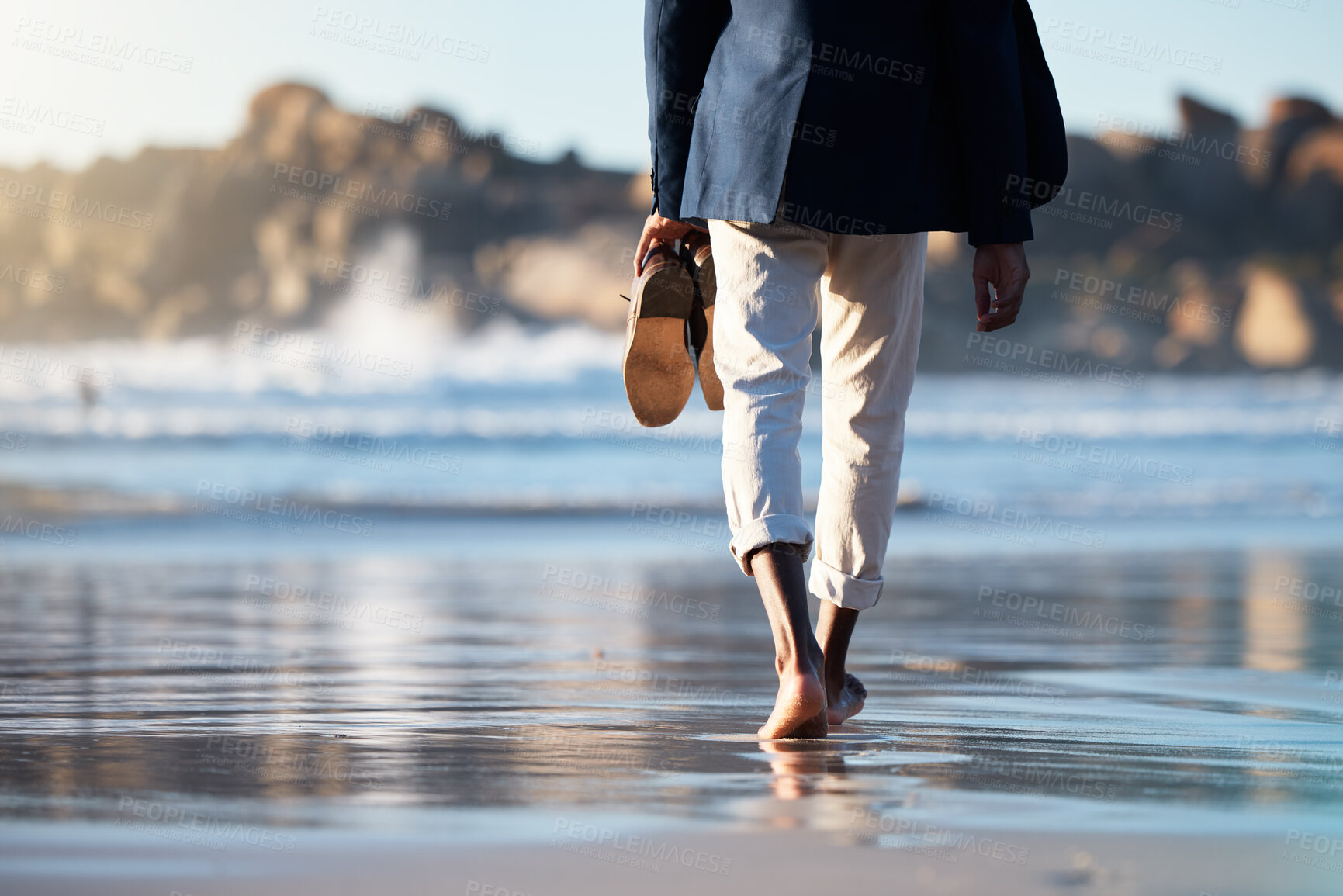 Buy stock photo Relax, beach and man walking with shoes in hand for peace, travel and wellness on vacation. Health, travel or summer with feet of guy step in the sand for calm, nature and lifestyle on Brazil holiday