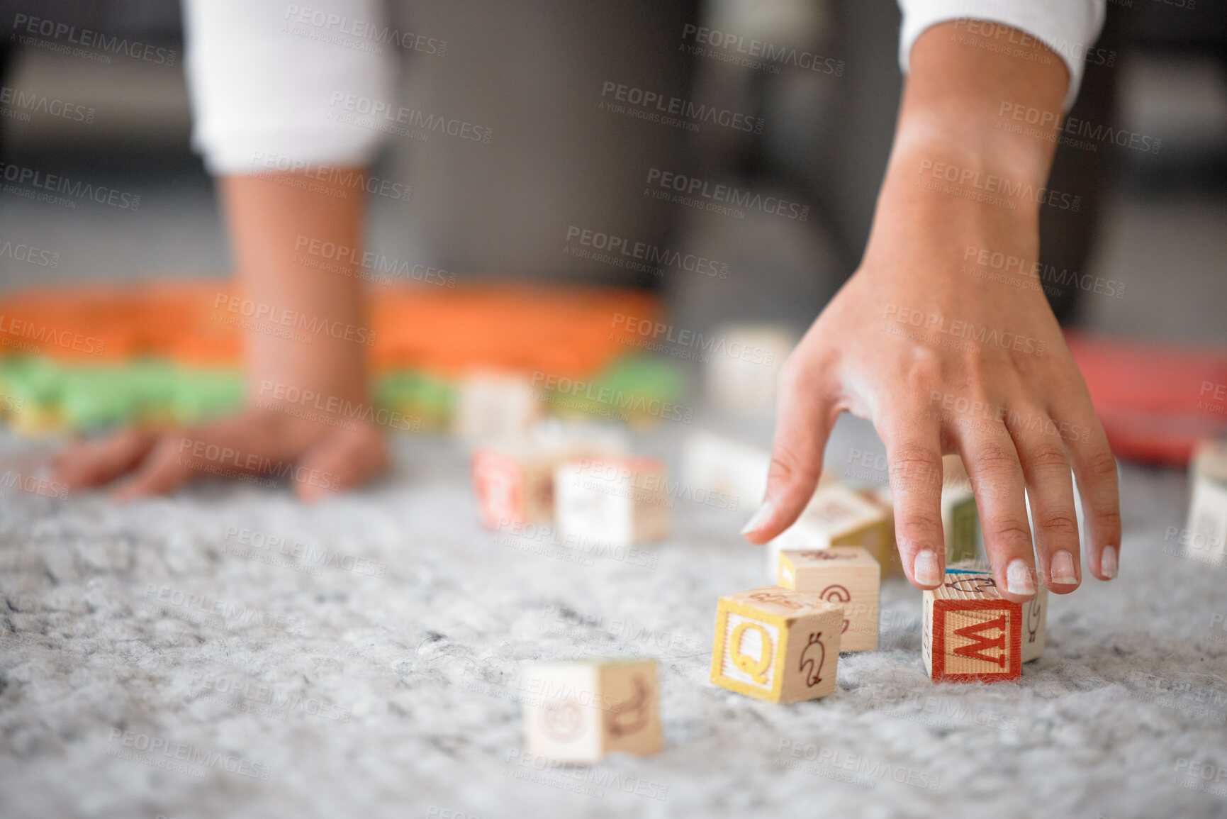 Buy stock photo Hands, cleaning and toys with a woman or mother picking up building blocks in the house to clean or tidy. Hand, responsible and object with a female cleaner working on a home floor for housework