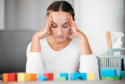 Buy stock photo Stress, headache and cleaning with an upset woman or mother in her home to clean up kids toys. Tired, exhausted and overworked with a female parent in her house, stressed or annoyed about mess