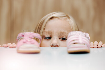 Buy stock photo Kids, fashion and shoes with a girl choosing between footwear while shopping in a retail store. Children, cute and choice with a young female child deciding what shoe to buy for her home wardrobe