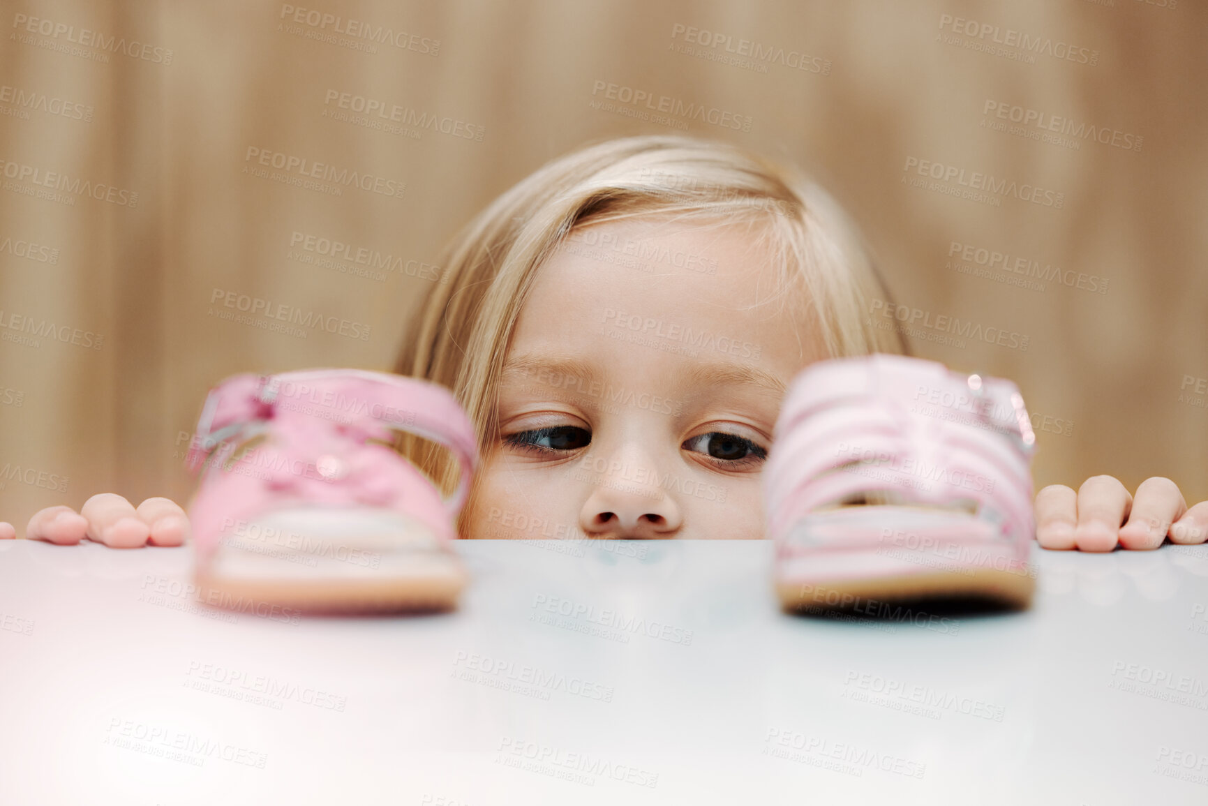 Buy stock photo Kids, fashion and shoes with a girl choosing between footwear while shopping in a retail store. Children, cute and choice with a young female child deciding what shoe to buy for her home wardrobe